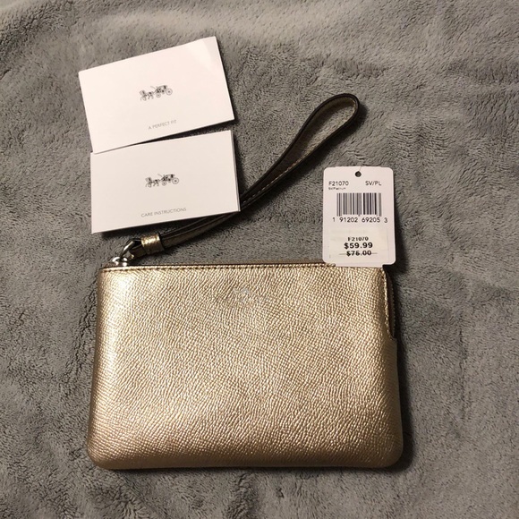 Coach Handbags - Coach gold wristlet